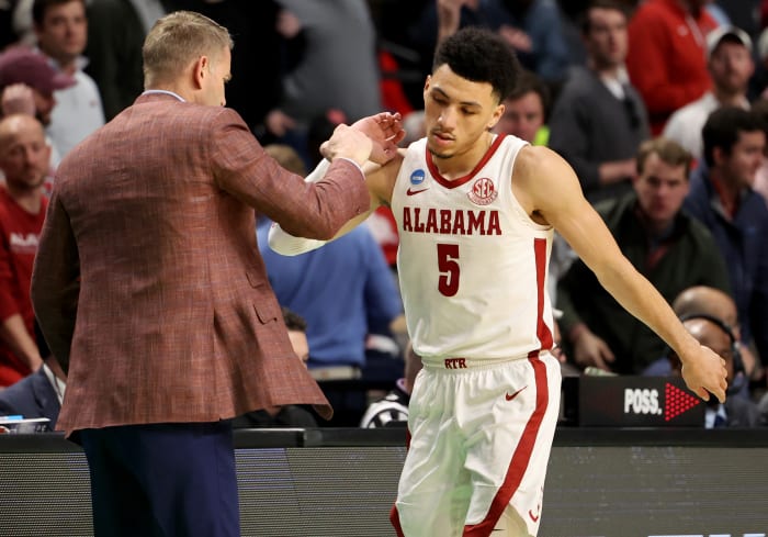 Mar 18, 2023; Birmingham, AL, USA; Alabama Crimson Tide head coach Nate Oats congratulates guard Jahvon Quinerly (5) during the second half against the Maryland Terrapins at Legacy Arena.